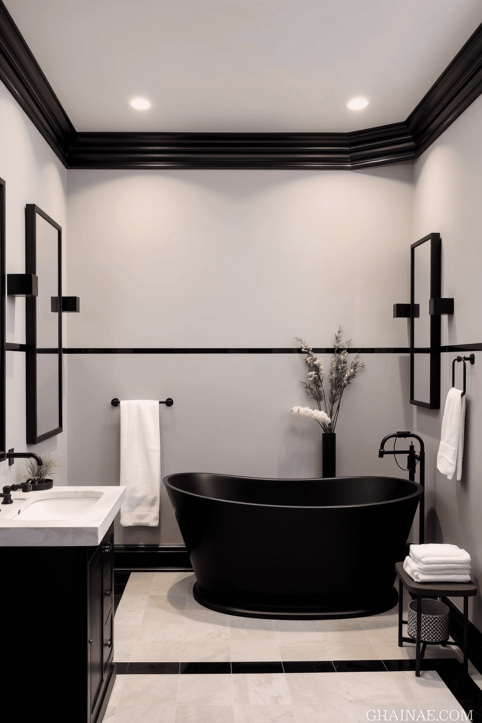 A serene bathroom space with soft gray walls paired with bold black trim for a striking yet balanced contrast. The muted palette creates a calming ambiance, while the sharp trim details offer modern sophistication. The room is anchored by a freestanding matte black bathtub, elegantly set against the gray tones of the walls. Accessories like black-framed mirrors and sleek fixtures add a cohesive touch, complemented by plush white towels and subtle greenery for added warmth.