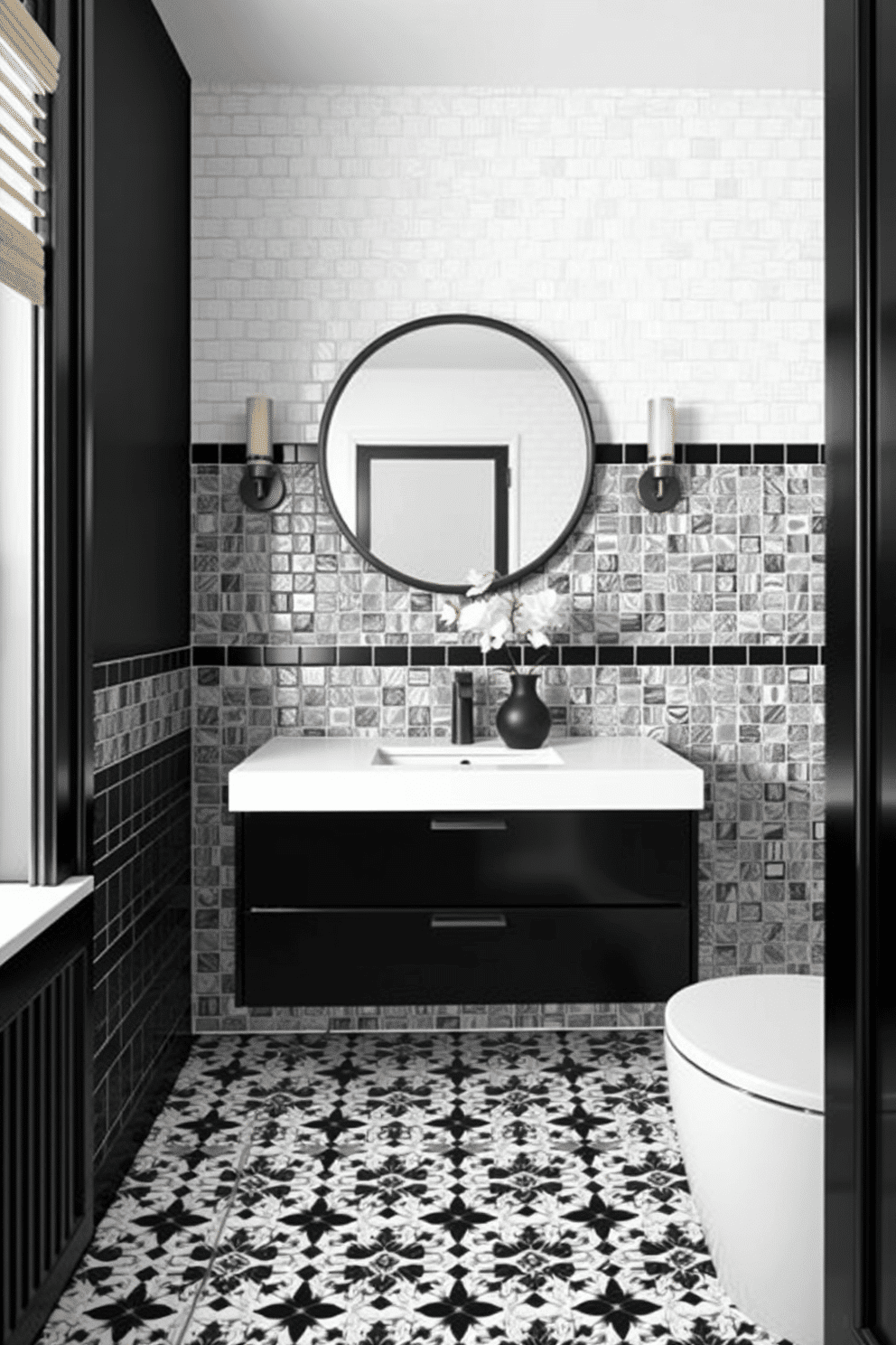 A striking bathroom adorned with monochromatic black and white mosaic tiles creating a bold and timeless statement. The intricate tile patterns cover both the floor and a feature wall behind the sleek black vanity, adding depth and visual interest to the space. The vanity is paired with a polished white countertop and a round black-framed mirror above it, completing the monochrome palette. Soft, warm lighting from wall sconces enhances the contrast while a single black vase with white flowers adds a touch of elegance.