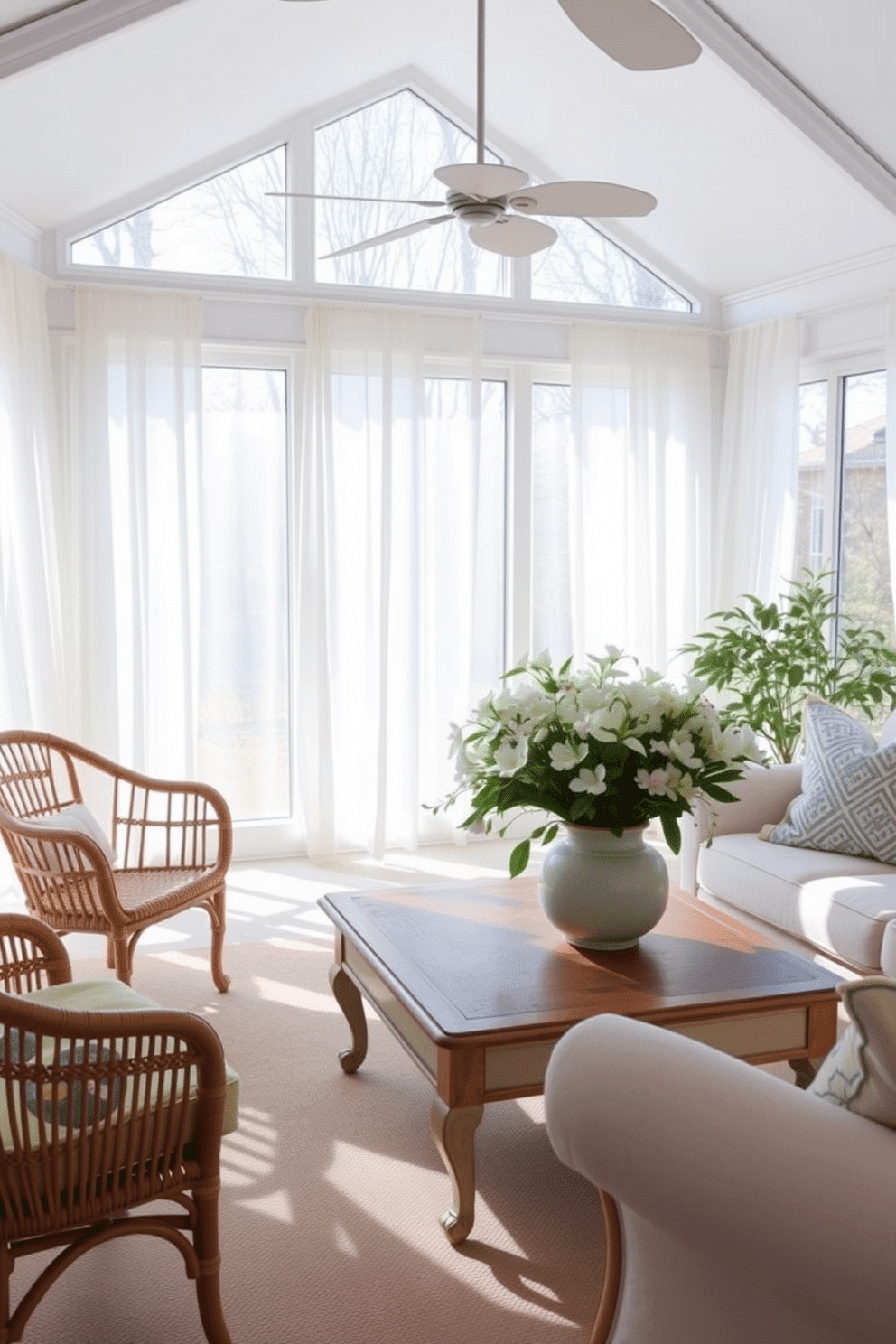 A bright and airy sunroom filled with natural light. Large windows adorned with sheer white curtains allow the sunshine to filter in, illuminating the space. In the center, a vintage coffee table serves as the focal point, topped with a bouquet of fresh spring flowers in a ceramic vase. Surrounding the table, comfortable seating includes a mix of rattan chairs and a plush sofa, inviting relaxation and conversation.