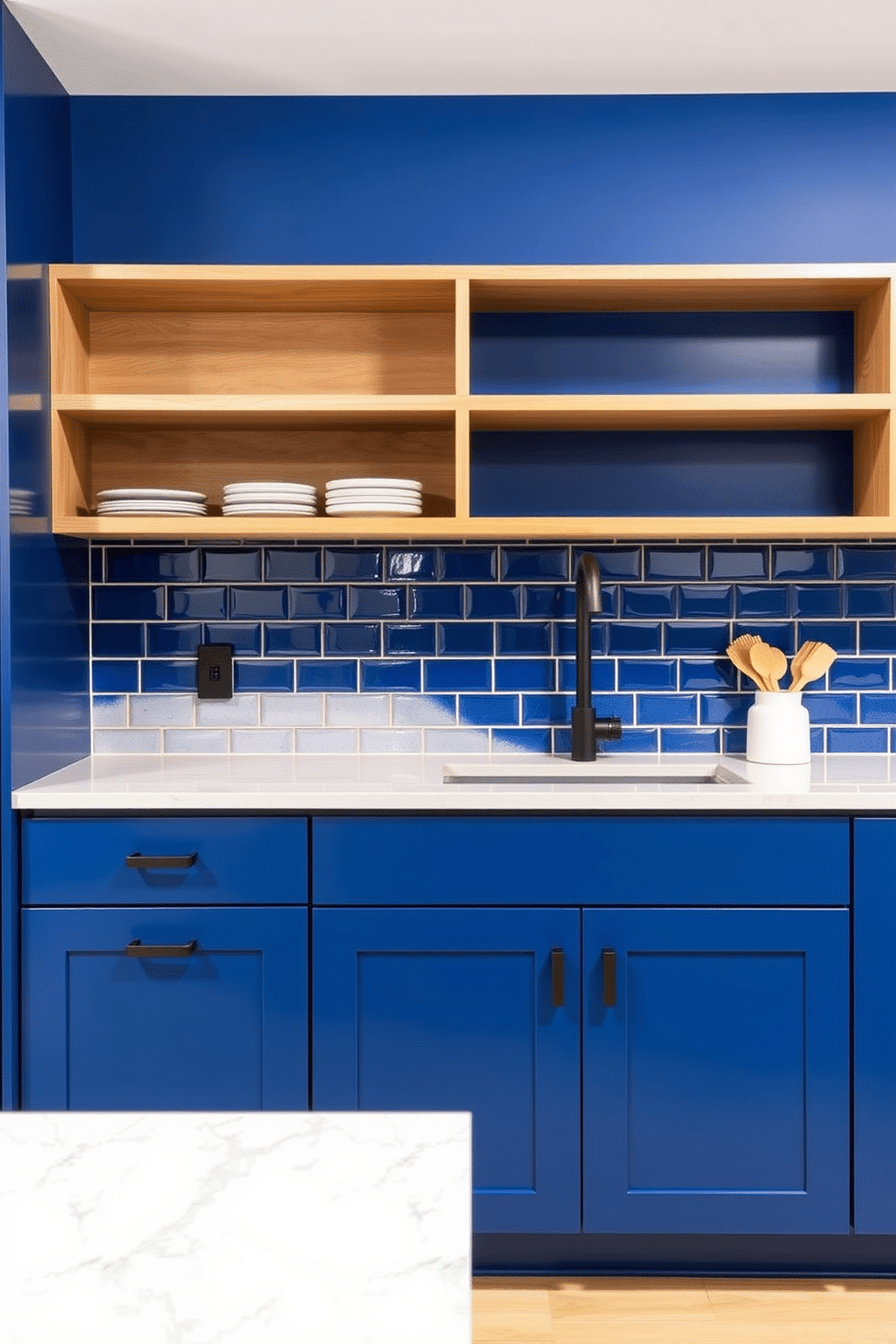 A two-tone kitchen design featuring cobalt blue and ash wood tones. The lower cabinets are painted in a deep cobalt blue, creating a bold statement, while the upper cabinets and open shelving are crafted from light ash wood for balance and warmth. A sleek quartz countertop with subtle veining ties the two tones together, while matte black hardware adds a modern touch. The backsplash showcases cobalt blue subway tiles with a glossy finish, reflecting light and enhancing the vibrancy of the space.