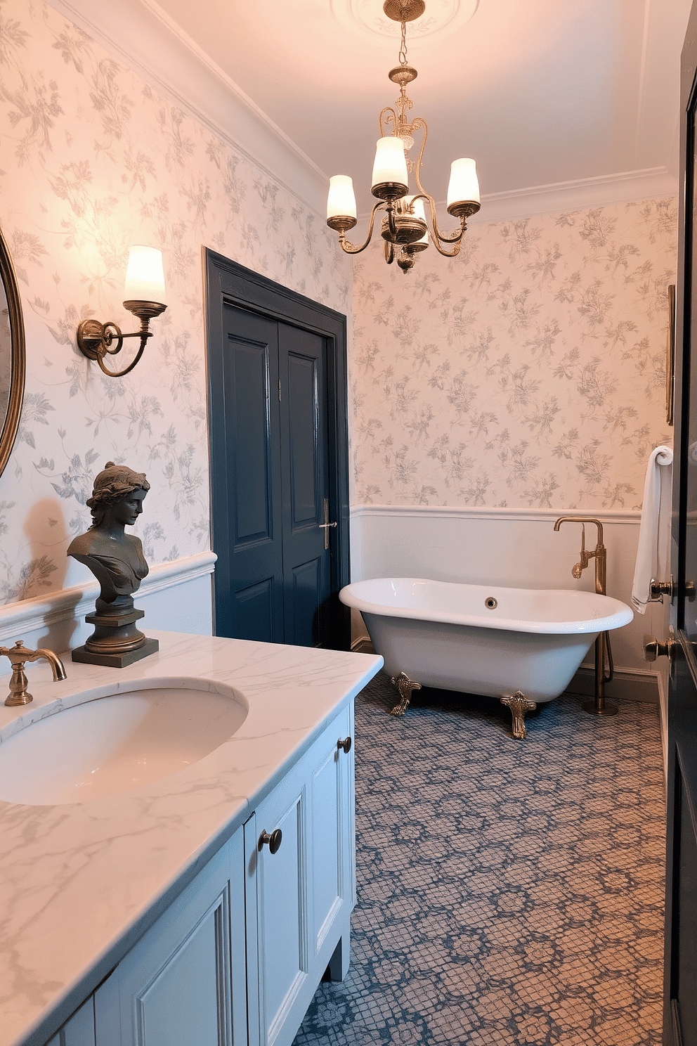 An elegant vintage bathroom adorned with antique bust statues for a timeless decorative touch. The statues sit gracefully on a solid marble countertop, complementing the soft cream tones of the walls, which are adorned with delicate floral wallpaper. The space features a freestanding clawfoot bathtub, its polished brass fixtures gleaming under the soft illumination of an ornate chandelier. Patterned mosaic tiles in muted blues and greys line the floor, creating an inviting atmosphere filled with old-world charm.